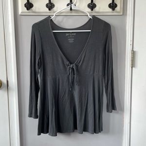 gray shirt with tie detail